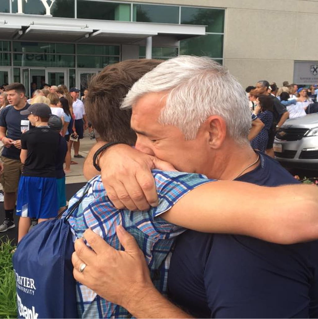 Photo of parent hugging their student goodbye